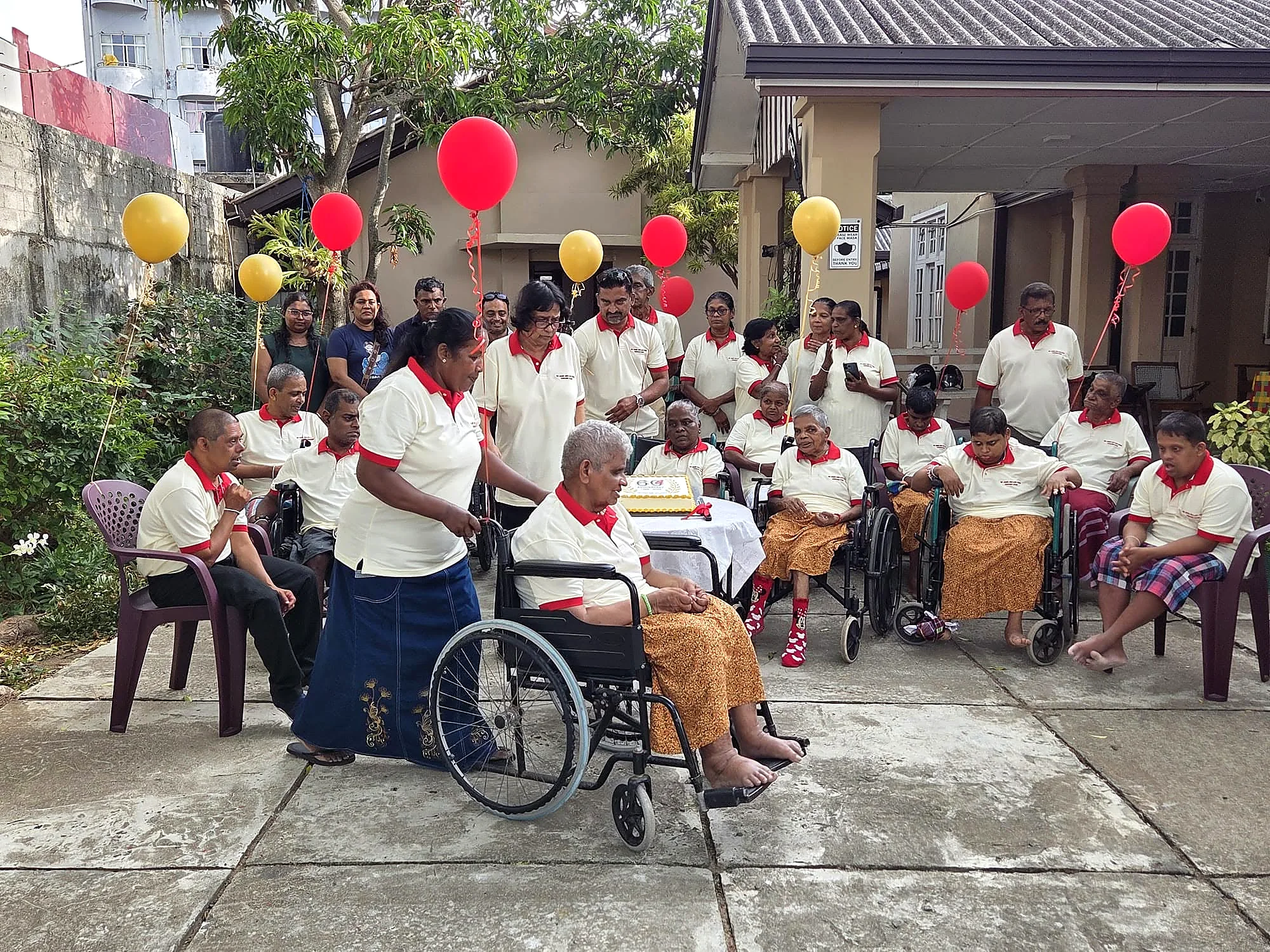 Residents and supporters at a 60th anniversary gathering